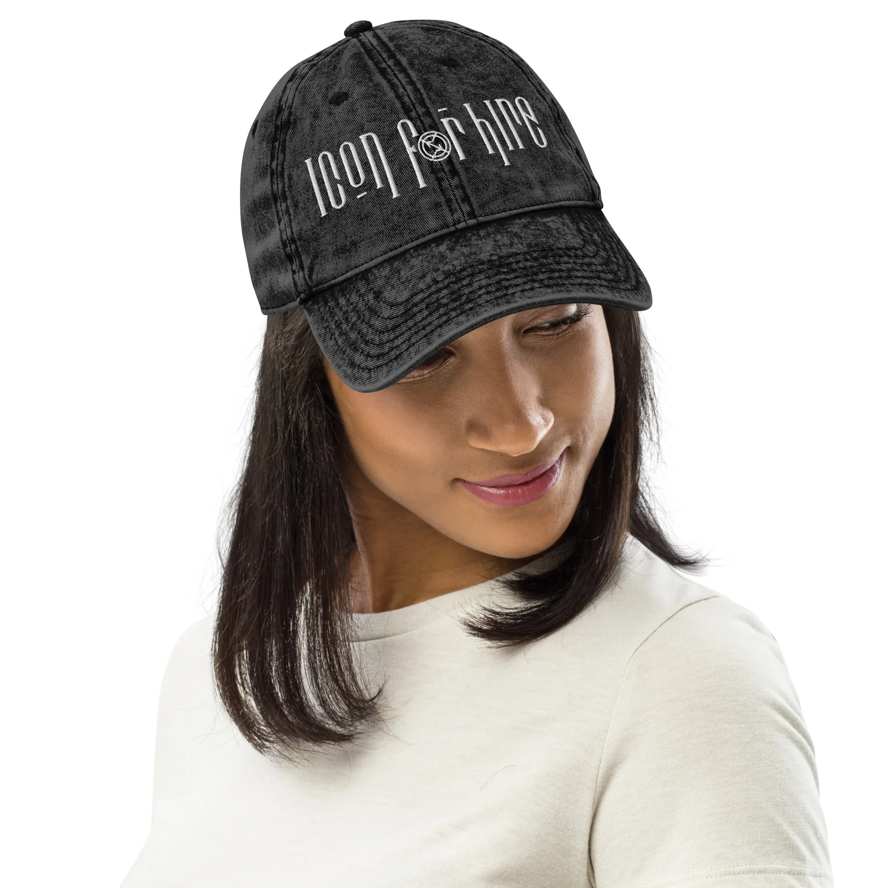 A model wearing a hat with 'Icon For Hire' embroidered.